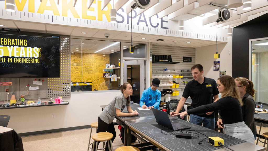 Students learning in the makerspace located in the Burge Dormitory at the University of Iowa