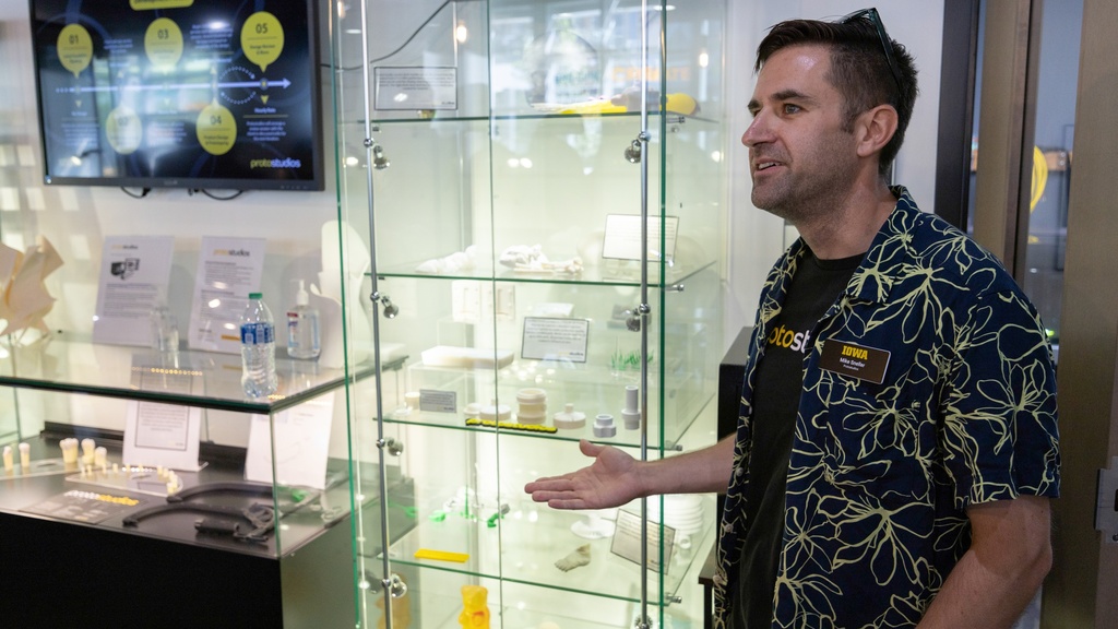 Mike Sneller in front of Protostudios case at MERGE coworking in Iowa City